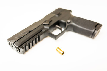 Handgun with ammo rounds and smoke