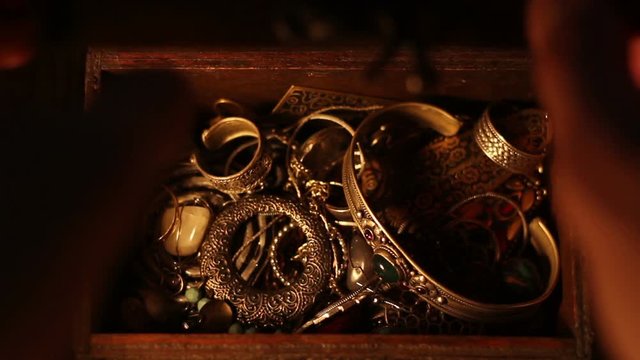 Hands searching than stealing the treasure Chest. 