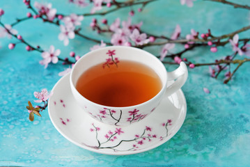 Tea cup on the blue background