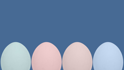 organic pastel colored eggs in a row