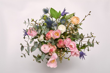 A colorful bouquet of spring flowers in white vase