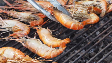 Sea food of shrimp grill cooking on charcoal strove