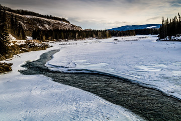Early thaw on the creek, Deer Creek Provincial Recreation Area, Alberta, Canada