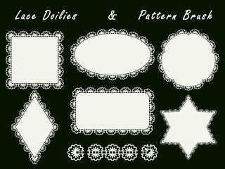 Set of openwork napkins of various shapes and pattern brush for the rim. Lace white elements for design isolated on a dark background.