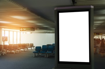 mock up of vertical blank advertising billboard or light box showcase with people waiting at airport, copy space for your text message or media content, advertisement, commercial and marketing concept