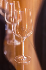 empty wine glasses in a row on the bar