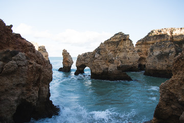Fototapeta na wymiar Sea Arch and Rugged Coastline in Lagos, Portugal