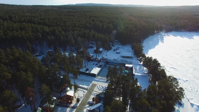 flight to the winter resort village, aerial view