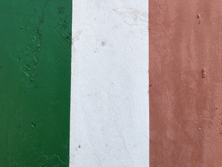 Italian flag, green red white, painted with paint on a concrete wall, emblem of the Italian state, symbol of patriotism and belonging to the republic, texture, background, travel, sport, Milan, Italy
