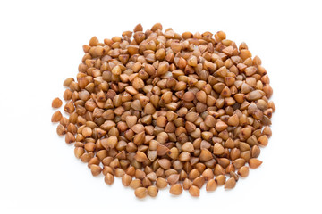 Buckwheat grains isolated on the white background.