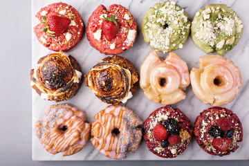 Variety of donuts on a marble surface