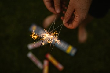 Holding Sparklers for the 4th of July - 197392385