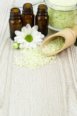 Fototapeta na wymiar Spa still life with blossoms of chrysanthemum white and essential oils.