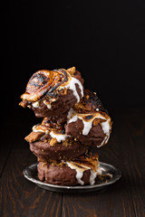 Smores donuts stack on dark background