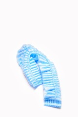 Blue medical disposable cap isolated on white