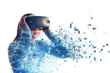 A person in virtual glasses flies to pixels. The woman with glasses of virtual reality. Future...