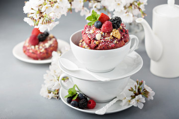 Berry shortcake donuts in a white cup