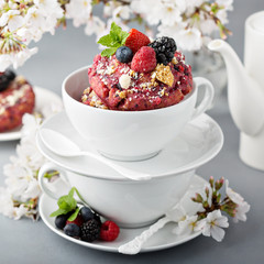 Berry shortcake donuts in a white cup