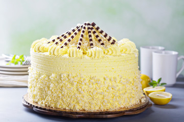 Lemon layered cake decorated with chocolate