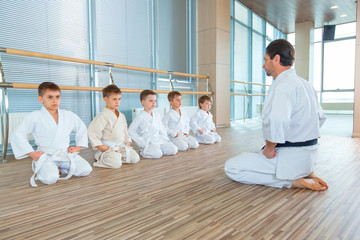 young, beautiful, successful multi ethical kids in karate position