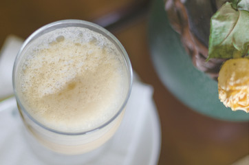 coffee raf with foam in a glass mug. view from above