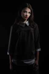 Naklejka premium Beautiful brown-haired girl with a strict suit in retro style