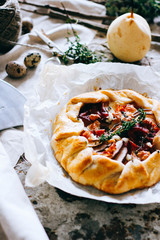 Galette with pear and prosciutto, in rustic style