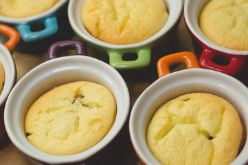 Cottage cheese casserole in colored ceramic forms in the form of