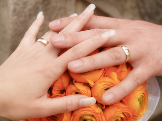 still life with wedding bouquet and wedding rings