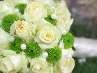 still life with wedding bouquet and wedding rings