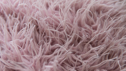 Artificial fur of pink color. Fashion goes to artificial fur