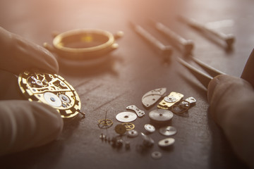 Watchmaker is repairing the mechanical watches in his workshop