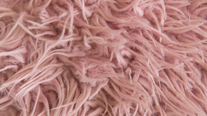 Artificial fur of pink color. Fashion goes to artificial fur