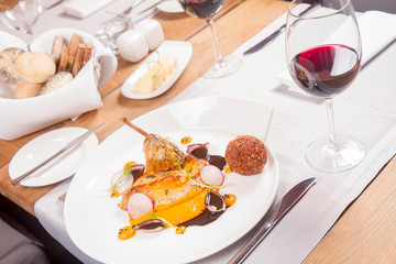Guinea fowl, pumpkin puree, fried buckwheat, gravy sauce served in a restaurant