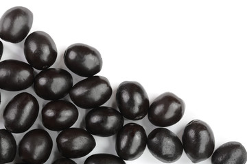 whole black olives isolated on white background with copy space for your text. Top view. Flat lay pattern