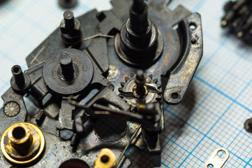 parts old retro film SLR camera on graph paper