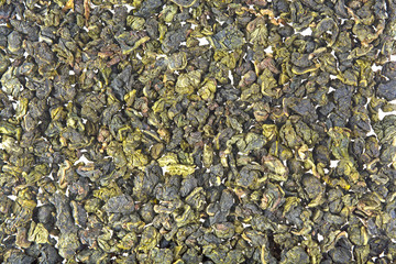 pile of green tea on white background