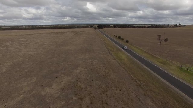 Aerial of highway through farm lands in Australia