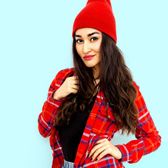 Pretty brunette Model Urban Fashion Look.  Checkered shirt and beanie cap