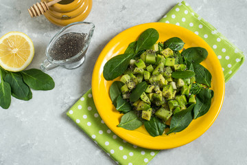 Vitamin vegetarian salad with avocado, kiwi, spinach and chia seeds