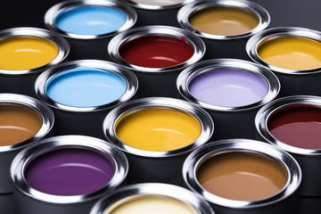 Fototapeta premium Buckets full of rainbow colored oil paint