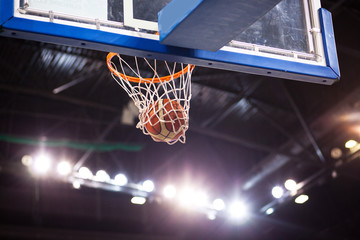 scoring during basketball game - ball going through hoop © Melinda Nagy