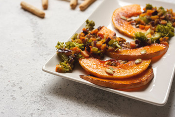 sliced baked pumpkin, with broccoli and assorted vegetables