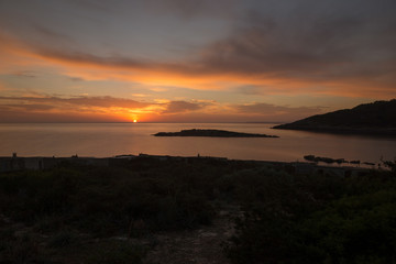 Fototapeta na wymiar Cala de Sal rossa at sunrise in Ibiza