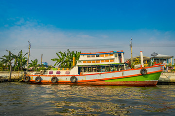 Fototapeta na wymiar Outdoor view of boat at riverside in the water in Bangkok yai canal or Khlong Bang Luang Tourist Attraction in Thailand