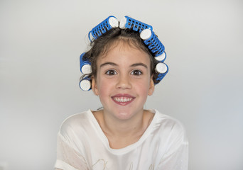 little girl posing with curlers
