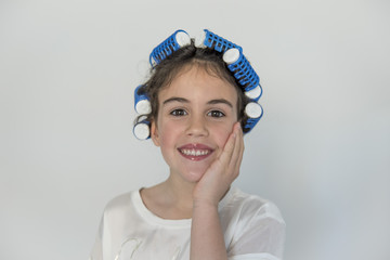 little girl posing with curlers