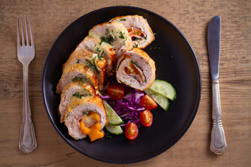 Chicken Cordon Bleu. Chicken breast wraps with ham and cheese, overhead, top view
