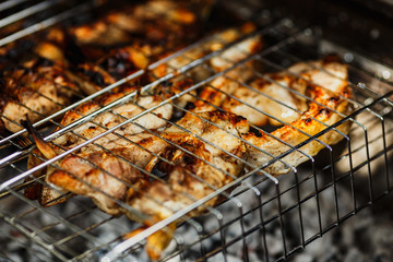 fish barbecue, the process of cooking fish on the grill