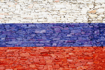 Fototapeta premium Russia flag on a brick background